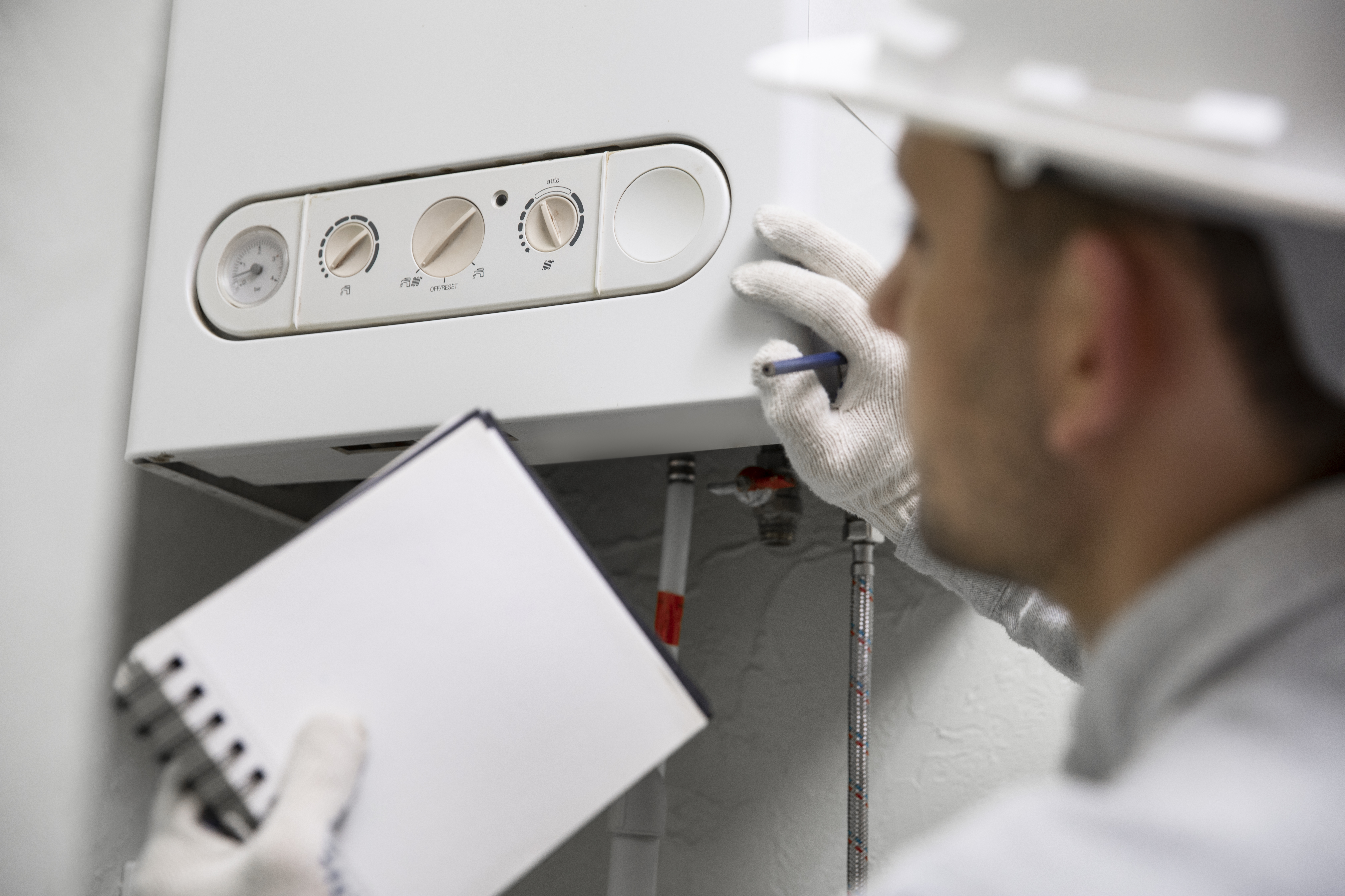 Worker Repairing Water Heater 1